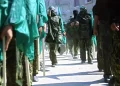 Masked members of Hamas hold Islamic flags during a 2002 march in the Jabalia refugee camp in the Gaza Strip to protest against the U.S. position on Jerusalem. Abid Katib/Getty Images
